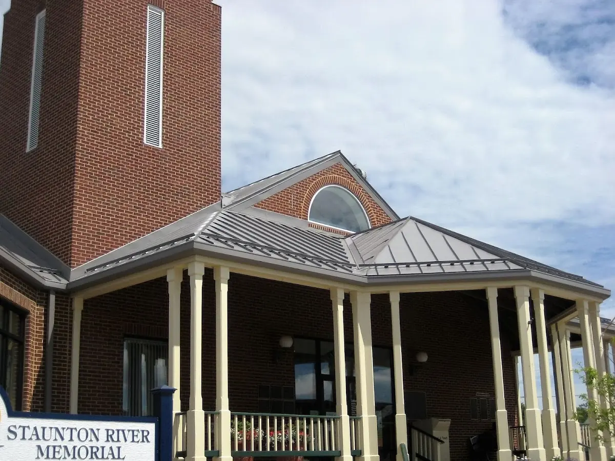 Skilled roofing craftsmen working on a residential roof in East Hanover